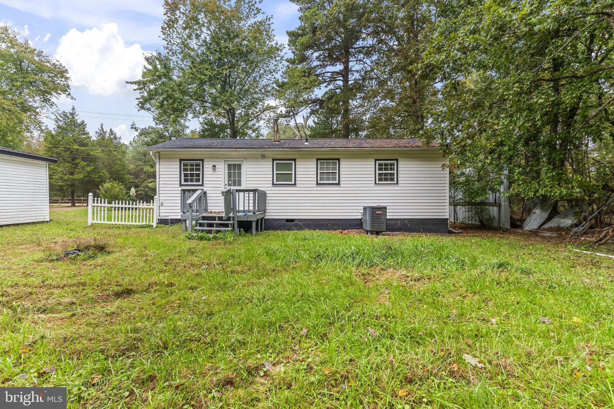 38461 Chaptico Road Mechanicsville, MD 20659 - Photo 31 of 35 front view of a house with a yard