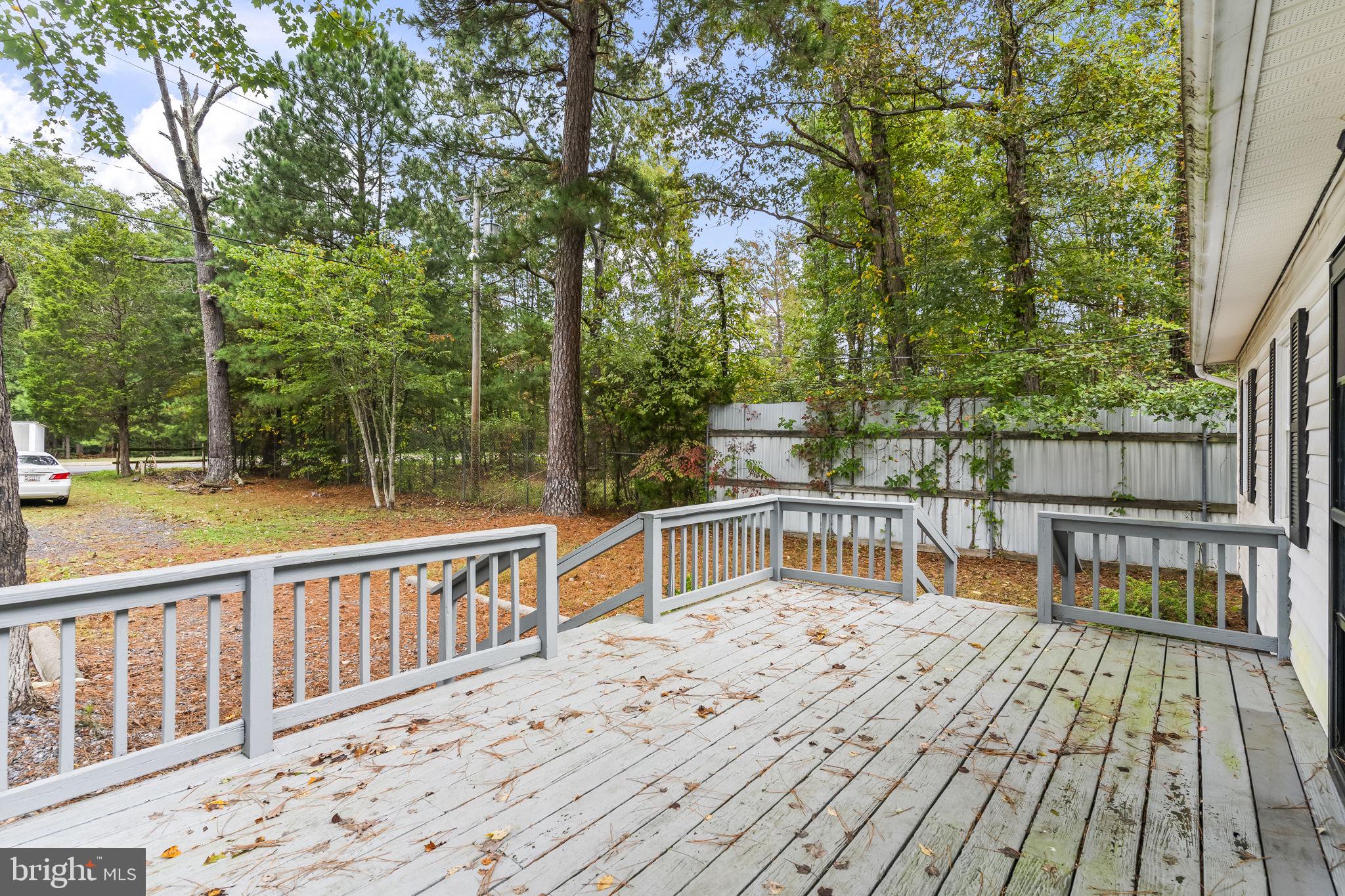 38461 Chaptico Road Mechanicsville, MD 20659 - Photo 6 of 35 a view of a wooden deck with large trees