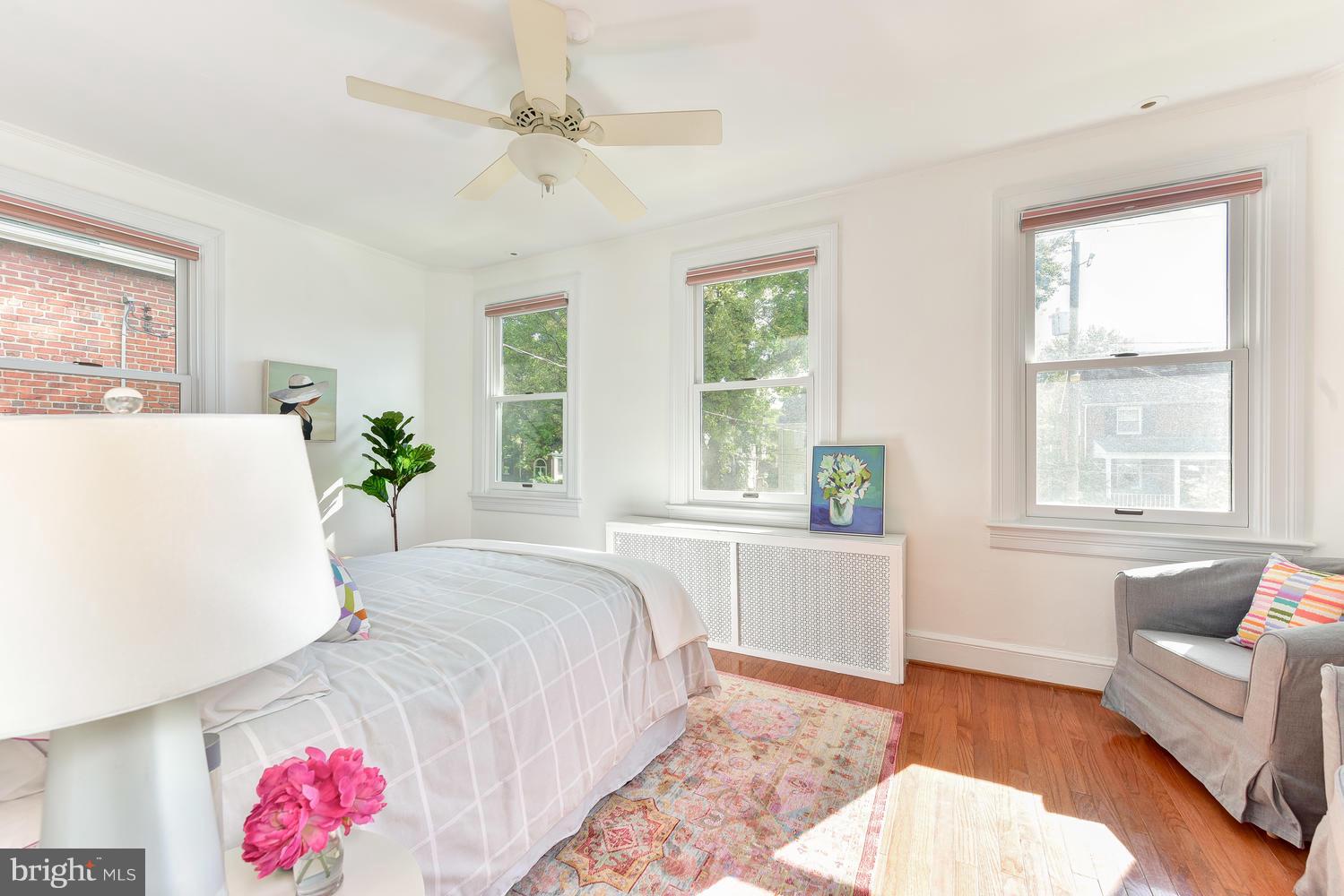 4427 Garrison Street Northwest Washington, DC 20016 - Photo 12 of 27 a spacious bedroom with a bed and a couch