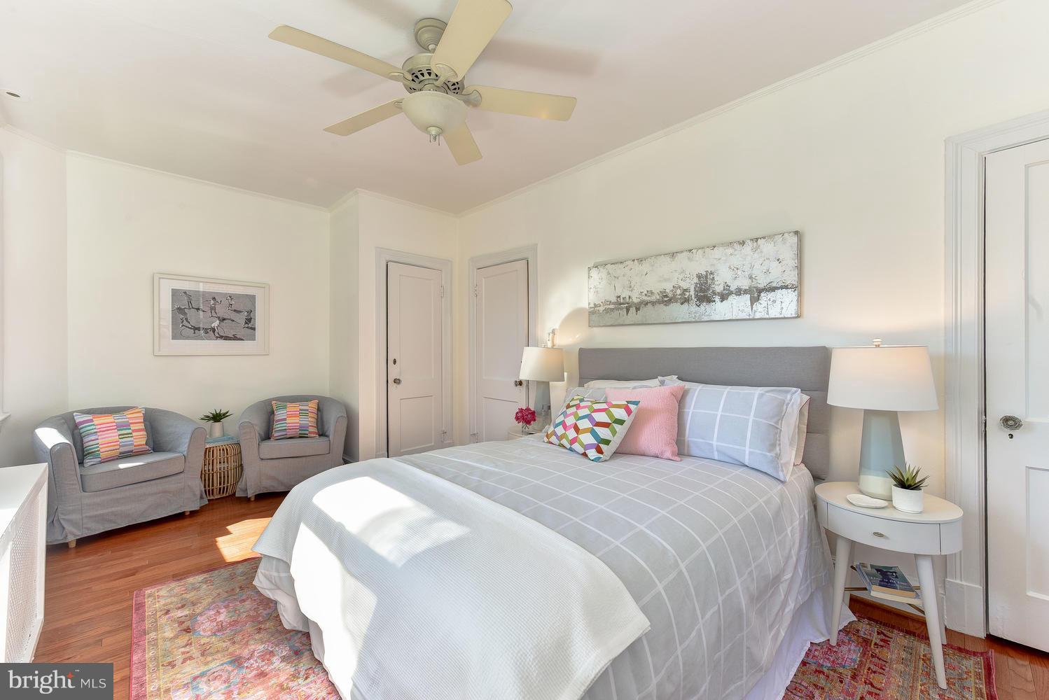 4427 Garrison Street Northwest Washington, DC 20016 - Photo 13 of 27 a bedroom with a bed and a chandelier