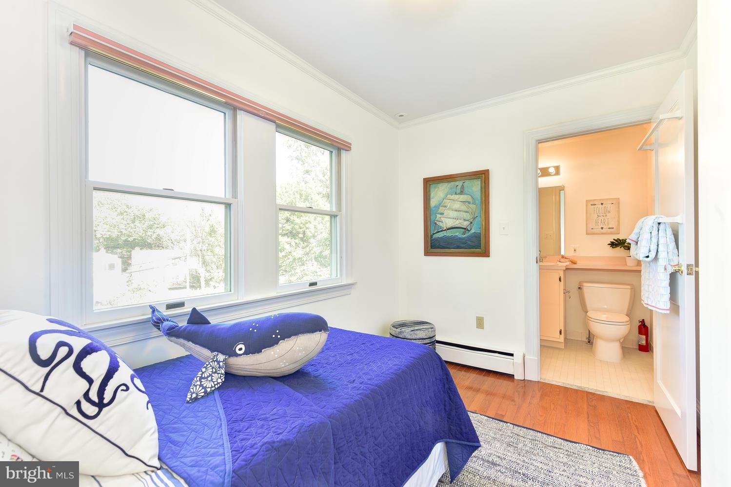 4427 Garrison Street Northwest Washington, DC 20016 - Photo 18 of 27 a bedroom with a bed and wooden floor