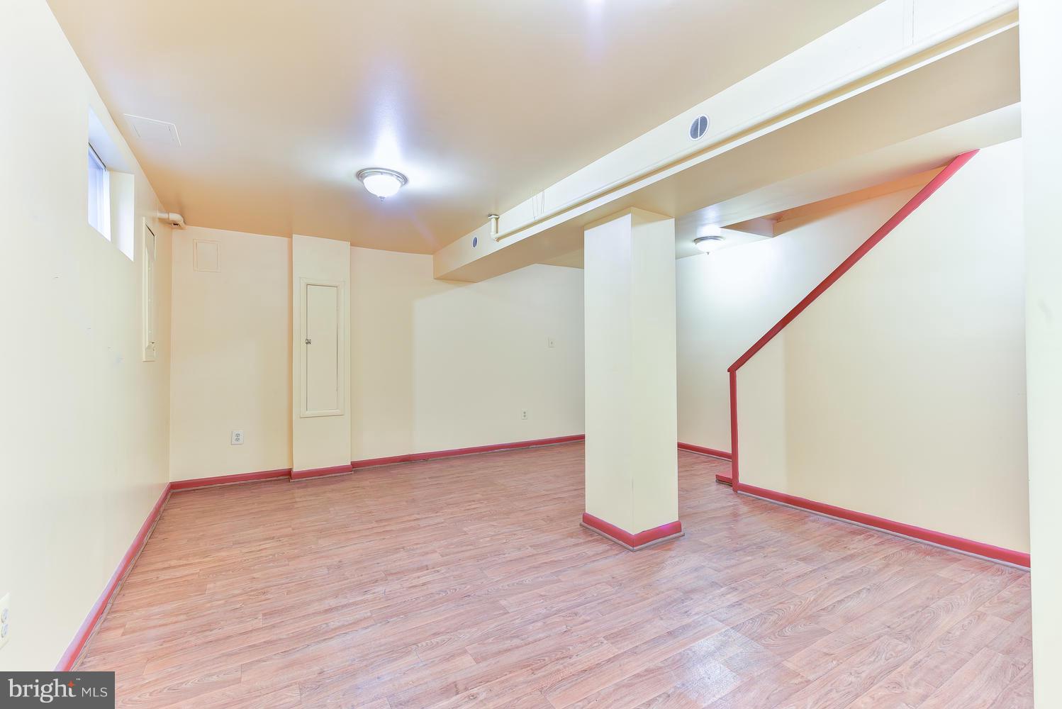 4427 Garrison Street Northwest Washington, DC 20016 - Photo 21 of 27 a view of an empty room with wooden floor