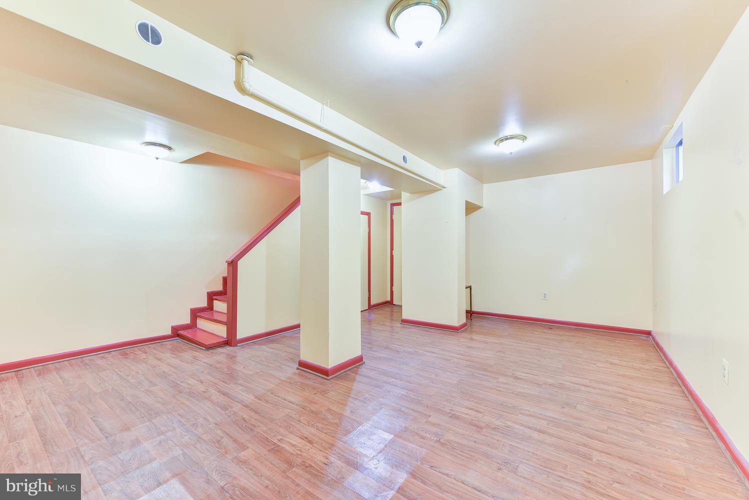 4427 Garrison Street Northwest Washington, DC 20016 - Photo 22 of 27 a view of an empty room with wooden floor
