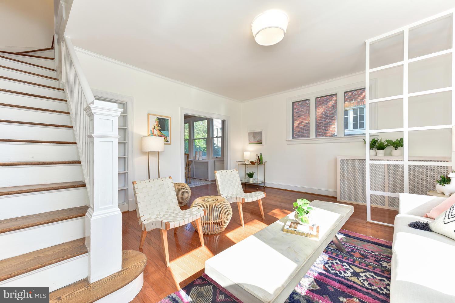 4427 Garrison Street Northwest Washington, DC 20016 - Photo 5 of 27 a living room with furniture a rug and white walls