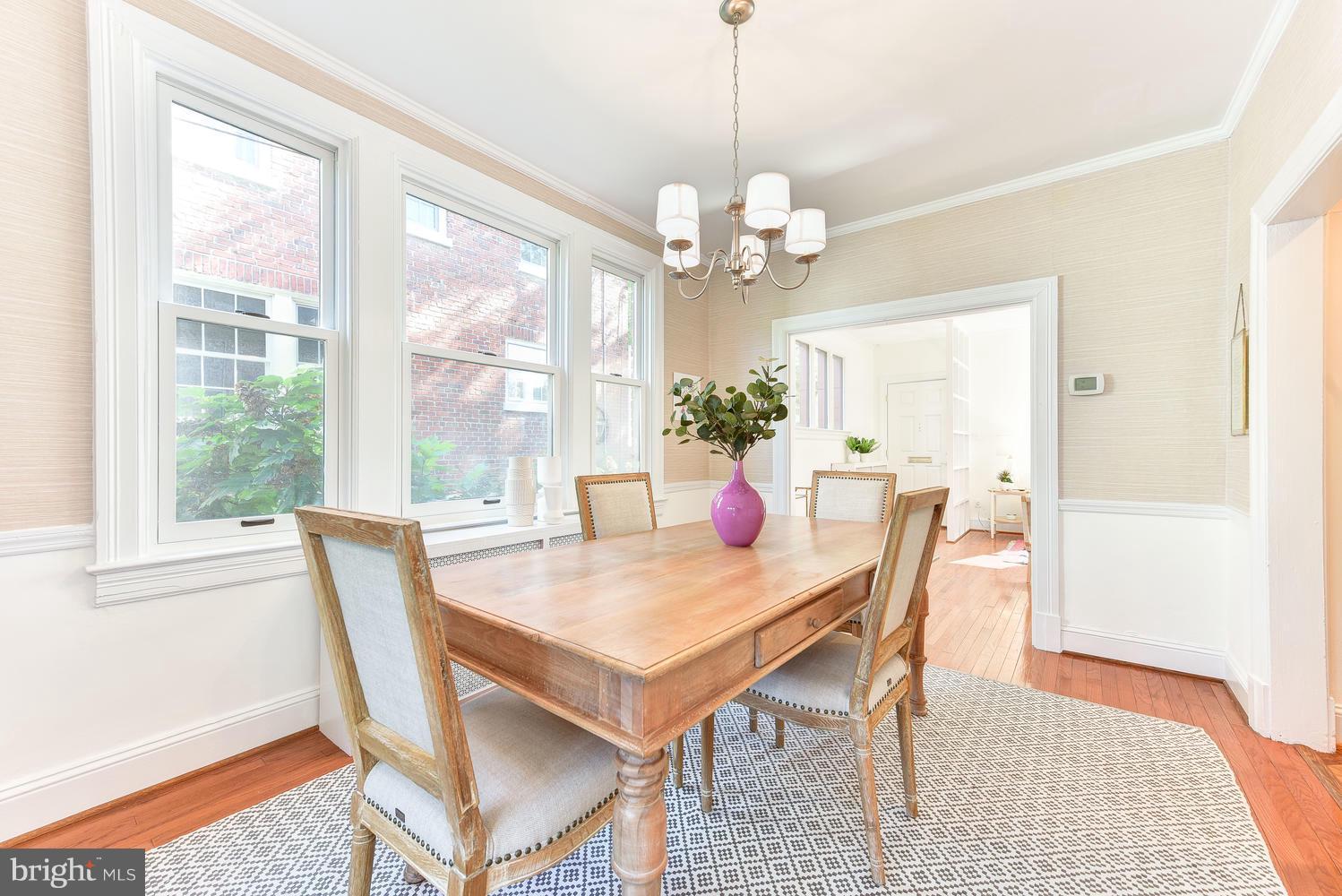 4427 Garrison Street Northwest Washington, DC 20016 - Photo 8 of 27 a view of a dining room with furniture a chandelier and wooden floor