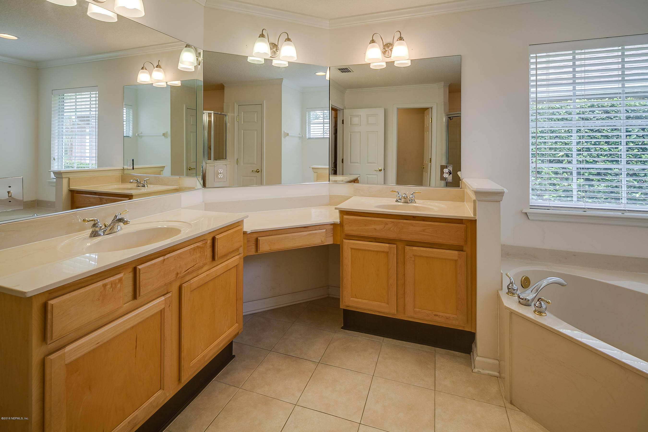 1727 Margarets Walk Road Fleming Island, FL 32003 - Photo 17 of 53 a spacious bathroom with a sink mirror and a bathtub