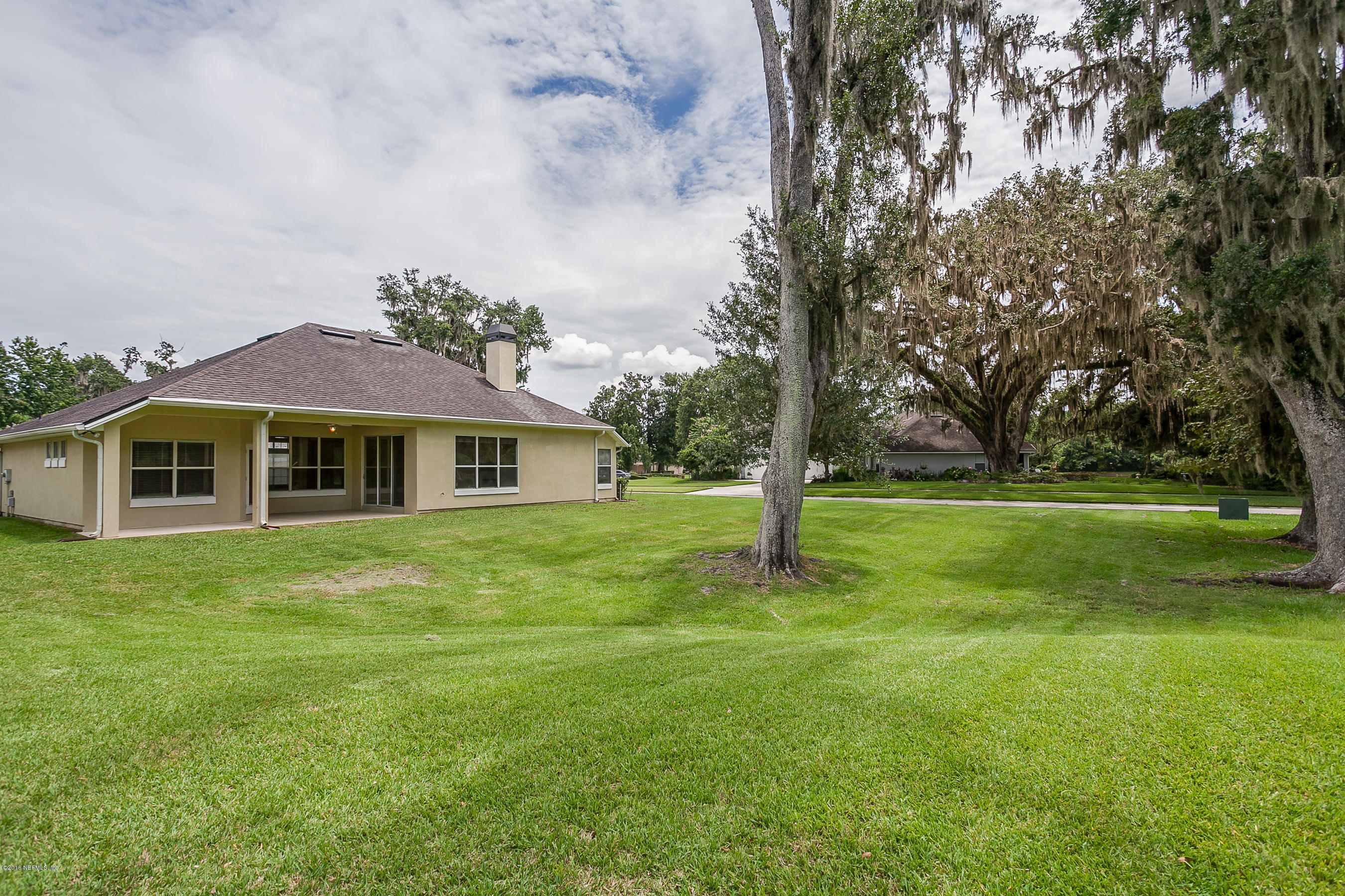 1727 Margarets Walk Road Fleming Island, FL 32003 - Photo 21 of 53 a front view of a house with a garden