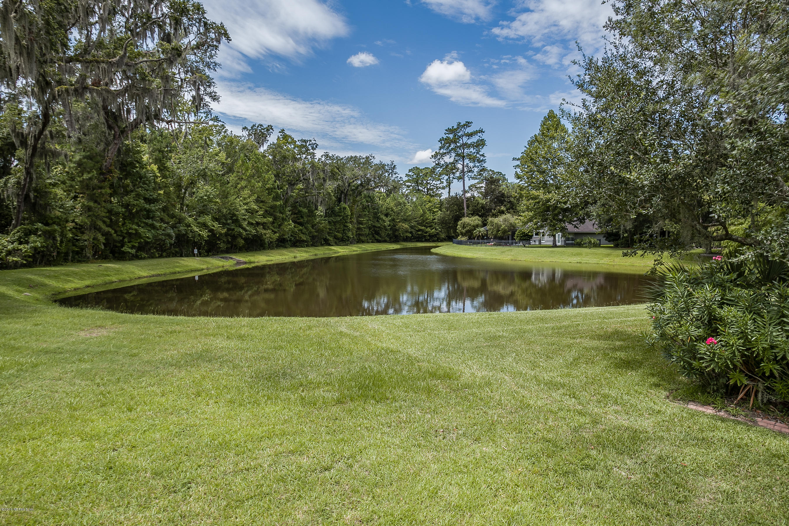 1727 Margarets Walk Road Fleming Island, FL 32003 - Photo 22 of 53 a view of a swimming pool with a yard and outdoor seating
