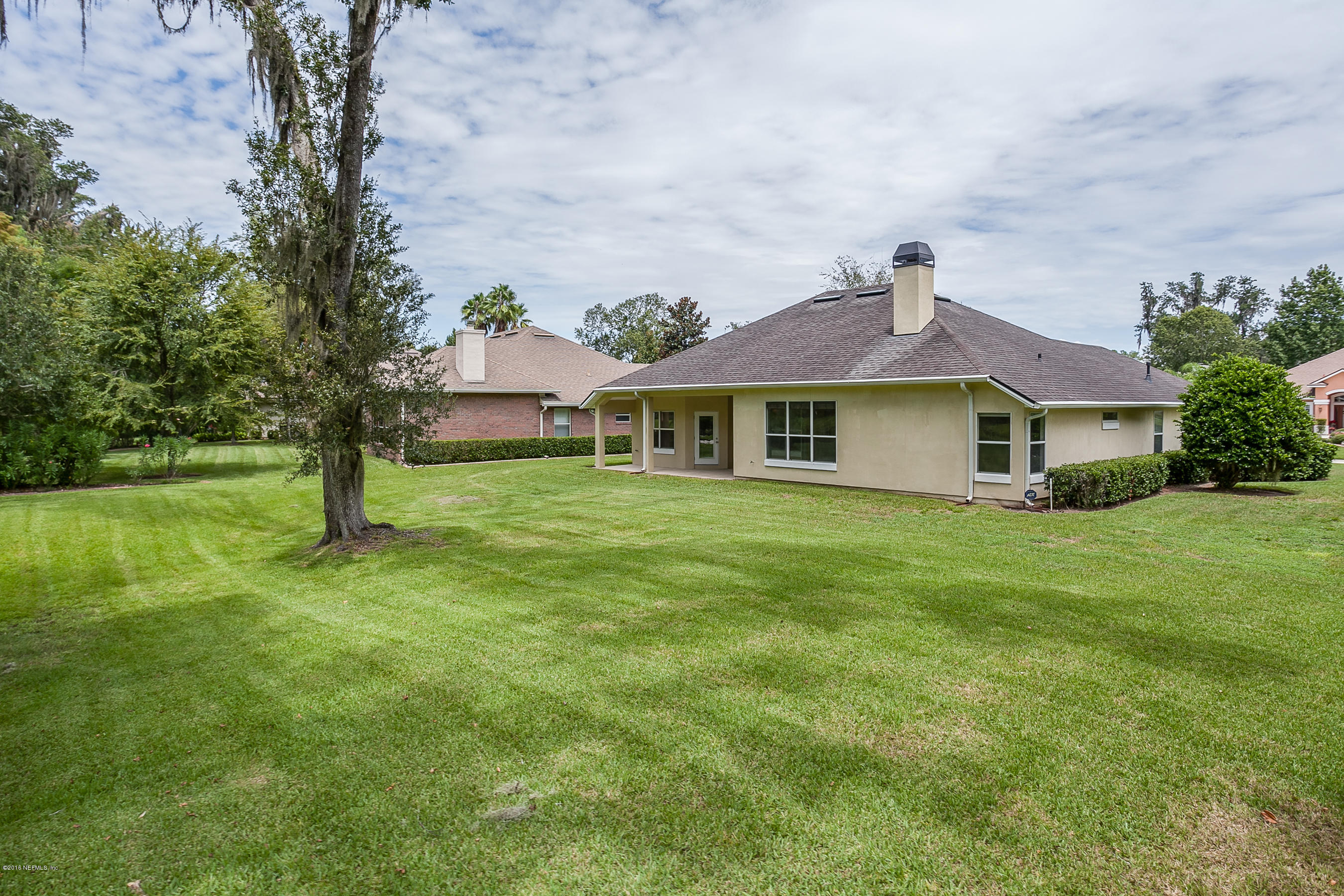1727 Margarets Walk Road Fleming Island, FL 32003 - Photo 23 of 53 a front view of a house with a garden