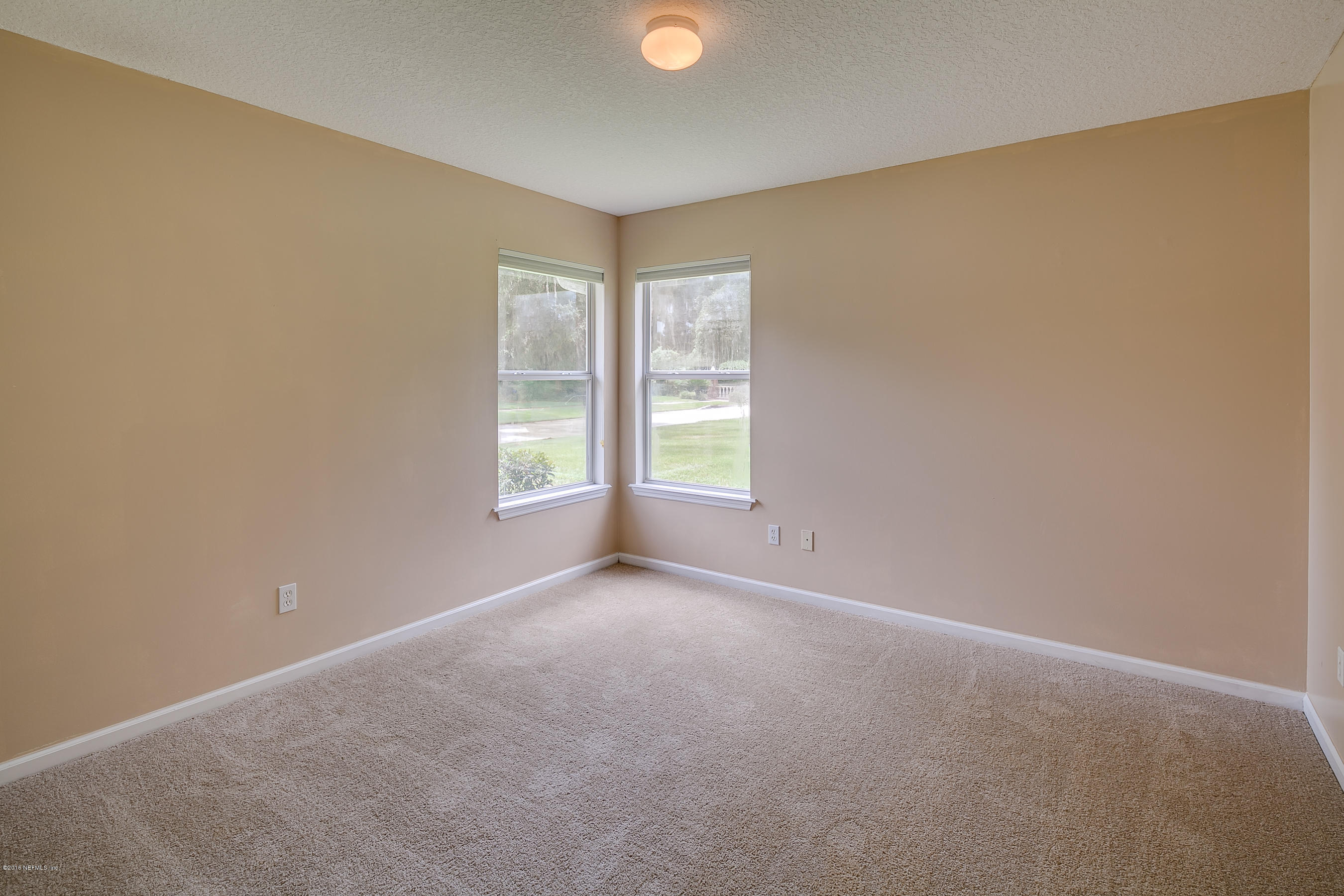 1727 Margarets Walk Road Fleming Island, FL 32003 - Photo 24 of 53 a view of an empty room with a window