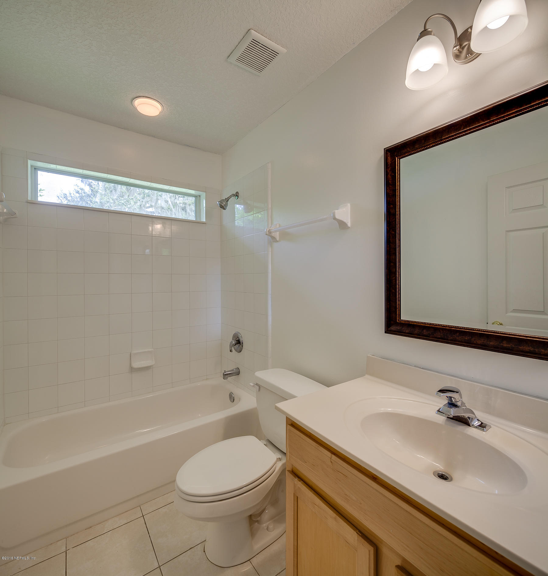 1727 Margarets Walk Road Fleming Island, FL 32003 - Photo 26 of 53 a bathroom with a sink a toilet and shower
