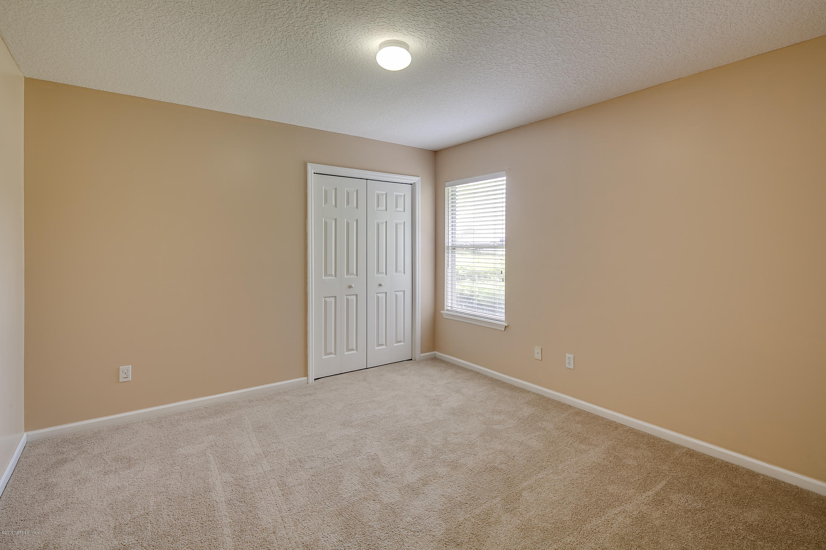 1727 Margarets Walk Road Fleming Island, FL 32003 - Photo 27 of 53 an empty room with windows