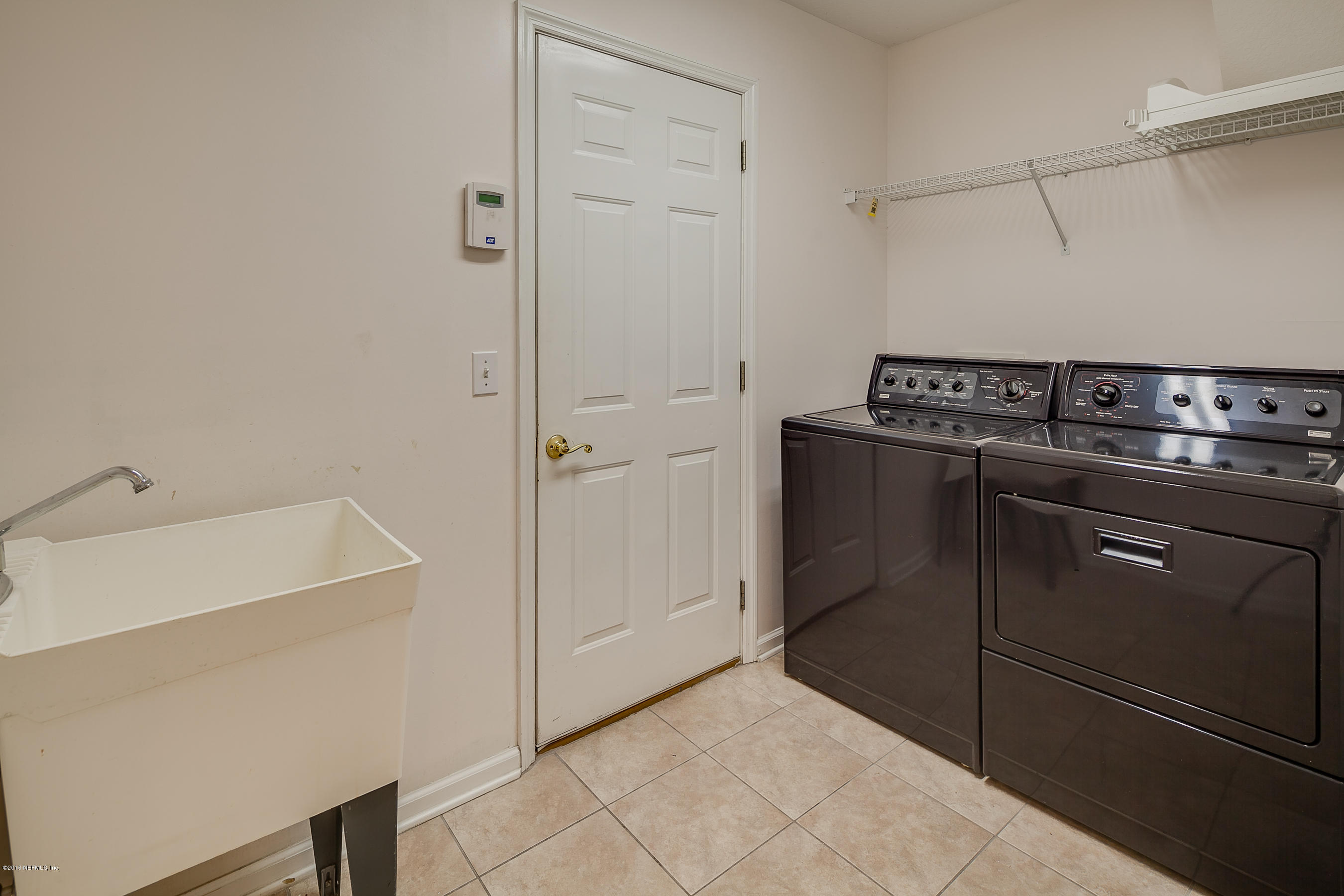 1727 Margarets Walk Road Fleming Island, FL 32003 - Photo 29 of 53 a kitchen with a stove and a refrigerator