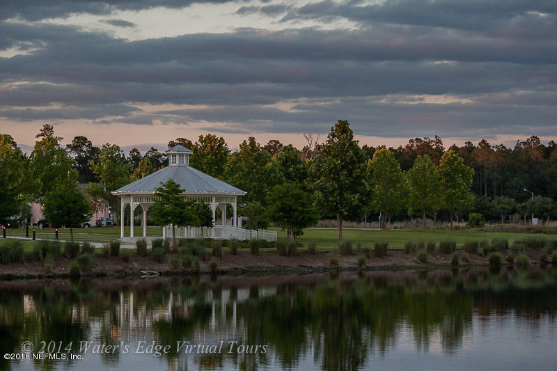 1727 Margarets Walk Road Fleming Island, FL 32003 - Photo 44 of 53 a view of a lake with houses in background