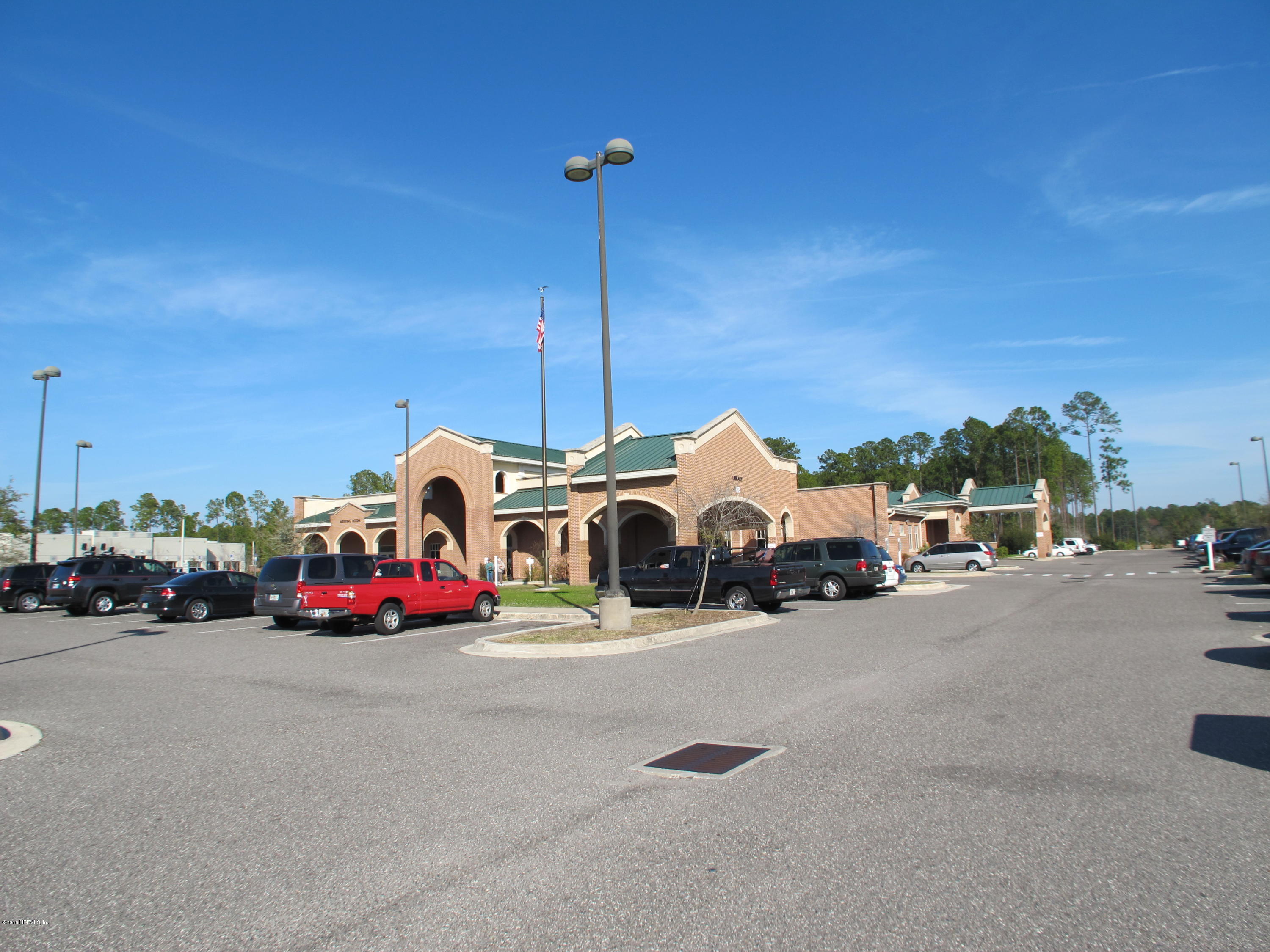 1727 Margarets Walk Road Fleming Island, FL 32003 - Photo 49 of 53 a view of a cars parked in front of a house
