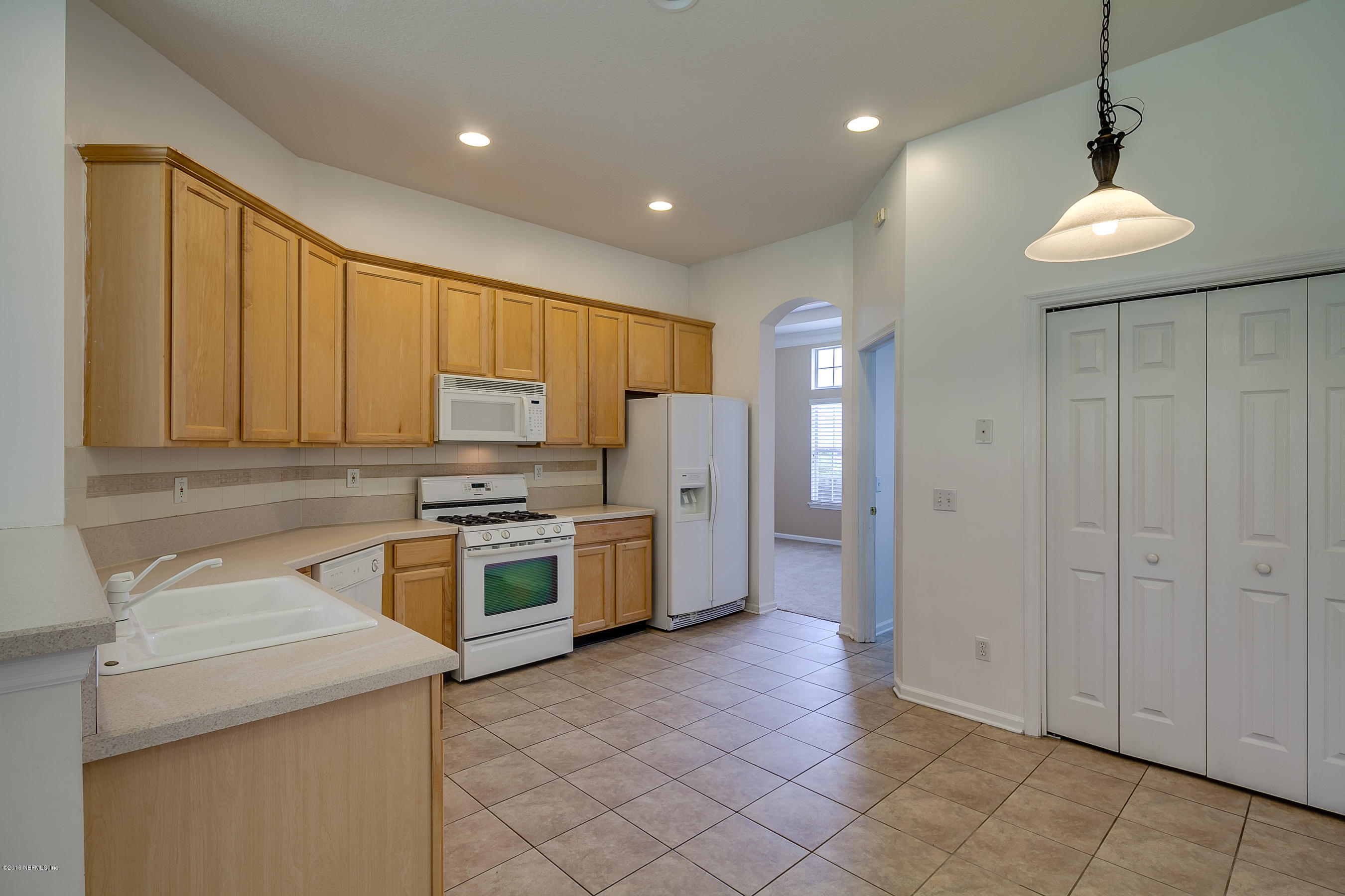 1727 Margarets Walk Road Fleming Island, FL 32003 - Photo 8 of 53 a kitchen with a stove a refrigerator and a sink