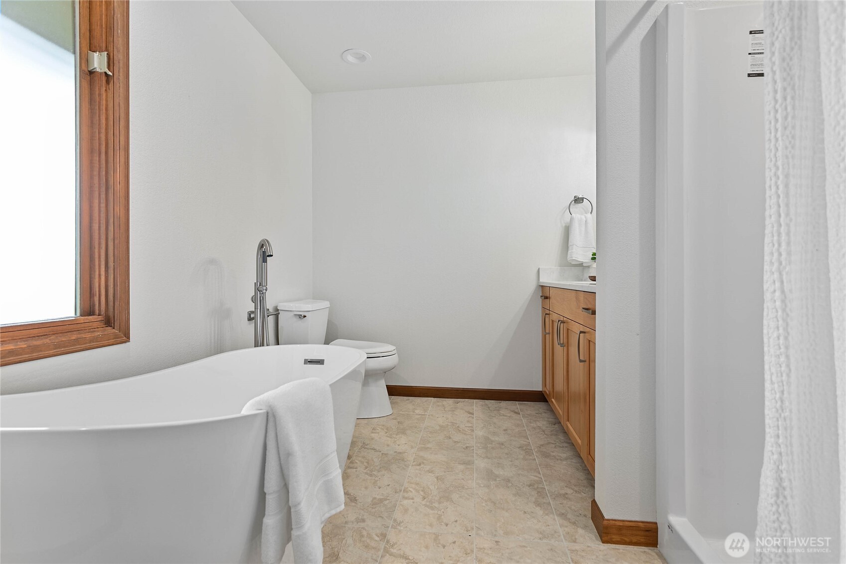 1133 East Pole Road Everson, WA 98247 - Photo 12 of 40 a bathroom with a sink a toilet and a mirror