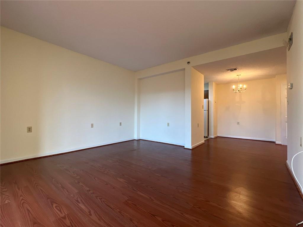 1800 Clairmont Lake, Unit 711 Decatur, GA 30033 - Photo 11 of 40 a view of an empty room with wooden floor