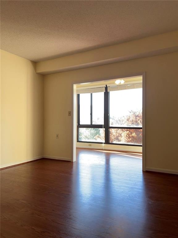 1800 Clairmont Lake, Unit 711 Decatur, GA 30033 - Photo 13 of 40 a view of empty room with wooden floor and fan
