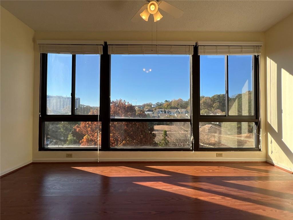 1800 Clairmont Lake, Unit 711 Decatur, GA 30033 - Photo 15 of 40 a view of porch with a floor to ceiling window wooden floor and outside space