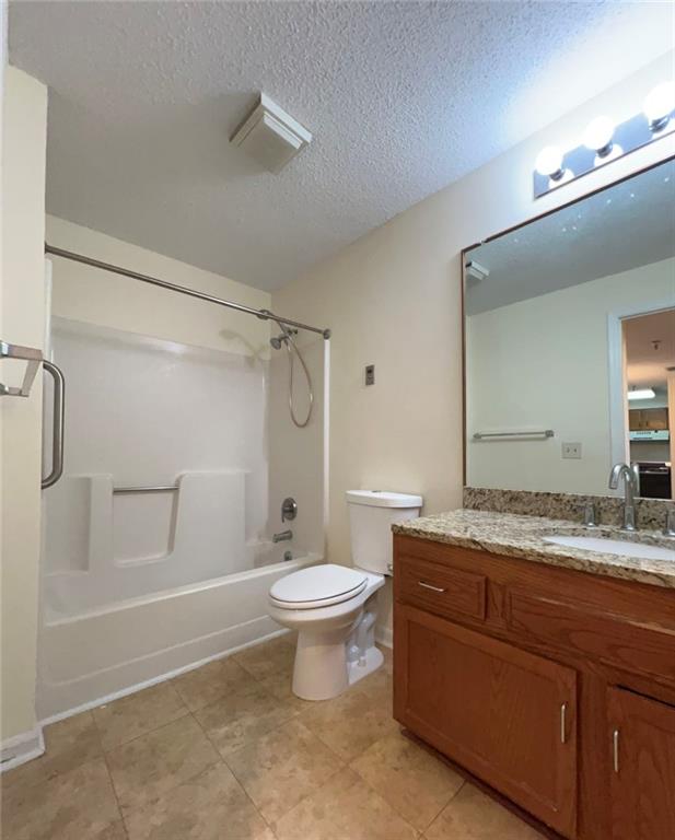 1800 Clairmont Lake, Unit 711 Decatur, GA 30033 - Photo 20 of 40 a bathroom with a granite countertop sink toilet a mirror and shower