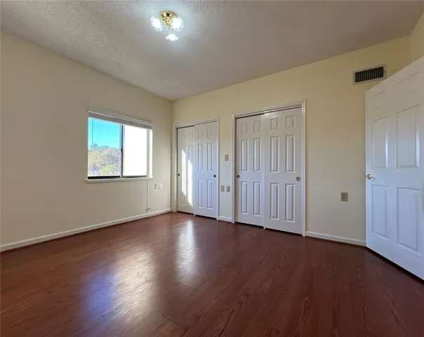 a living room with a fireplace and a potted plant