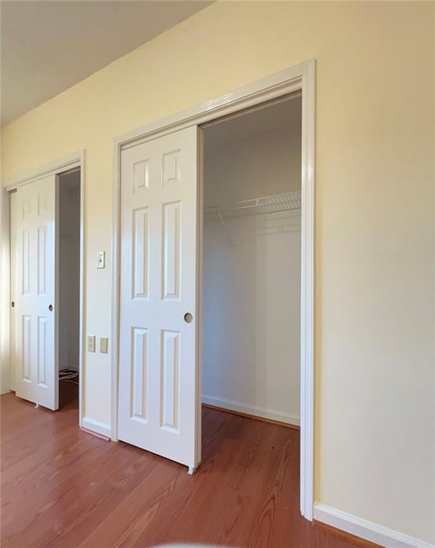 1800 Clairmont Lake, Unit 711 Decatur, GA 30033 - Photo 26 of 40 an empty room with wooden floor & closet area