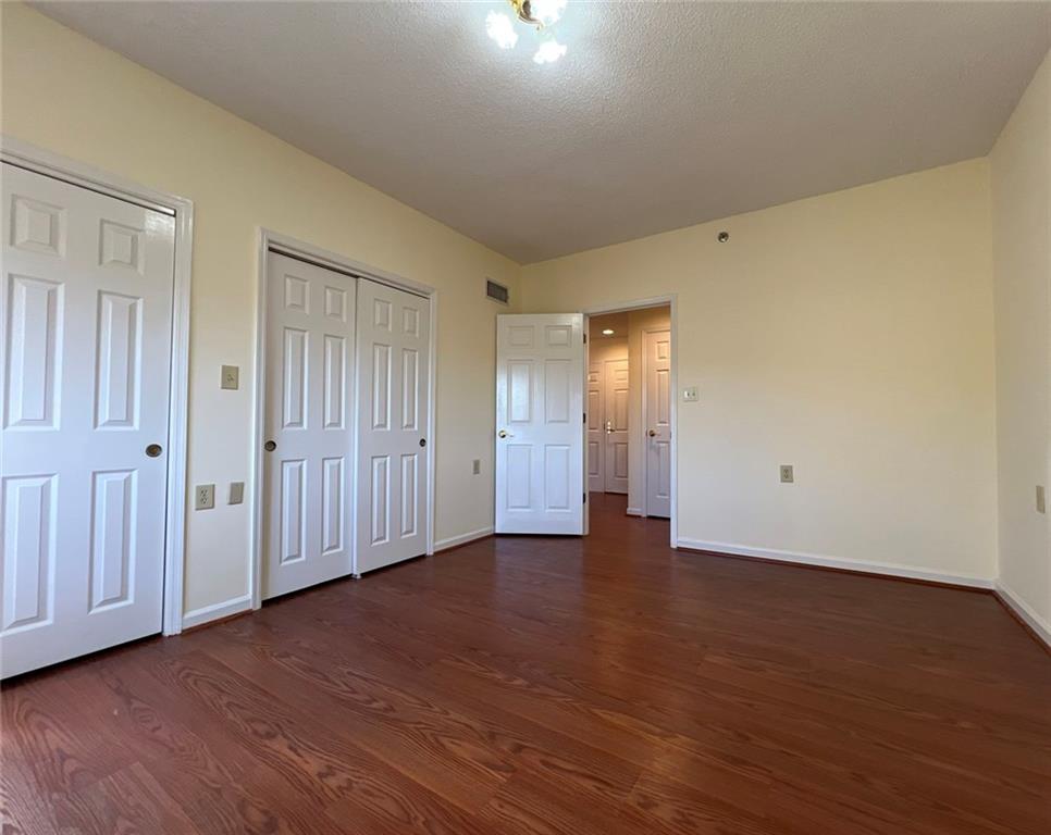 1800 Clairmont Lake, Unit 711 Decatur, GA 30033 - Photo 27 of 40 a view of an empty room with wooden floor