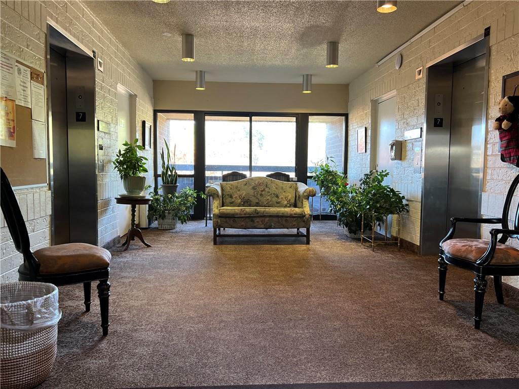 1800 Clairmont Lake, Unit 711 Decatur, GA 30033 - Photo 29 of 40 a living room with furniture and a potted plant