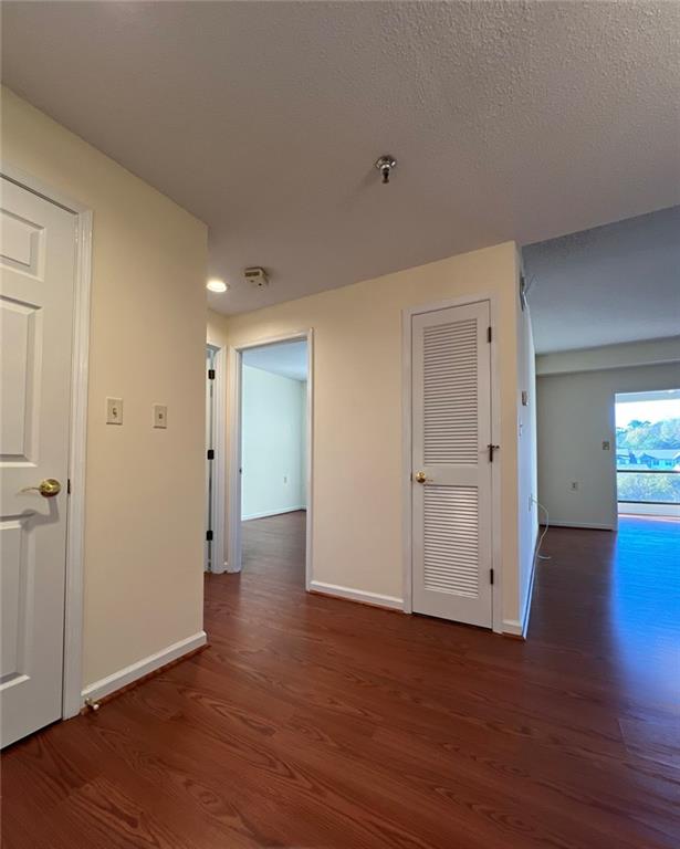 1800 Clairmont Lake, Unit 711 Decatur, GA 30033 - Photo 3 of 40 an empty room with wooden floor & windows and bathroom