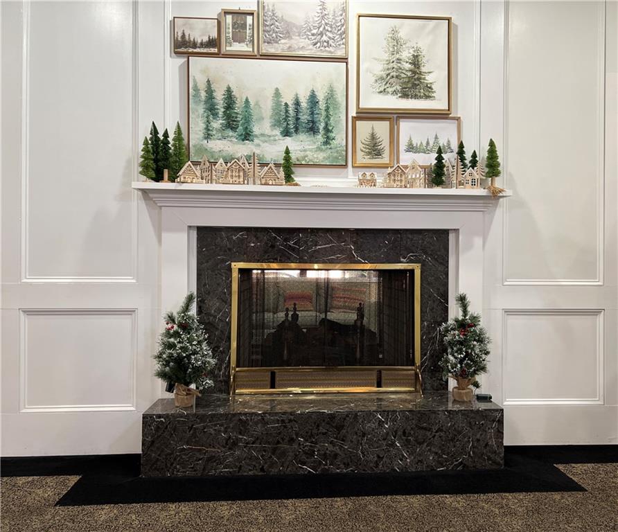 1800 Clairmont Lake, Unit 711 Decatur, GA 30033 - Photo 35 of 40 a living room with a fireplace and a potted plant