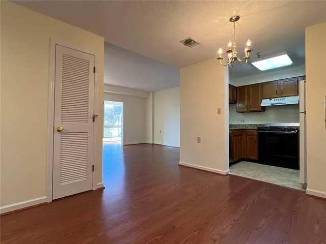 a kitchen with stainless steel appliances granite countertop a stove and a sink