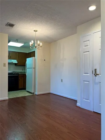 a view of a kitchen with a sink and a stove top oven