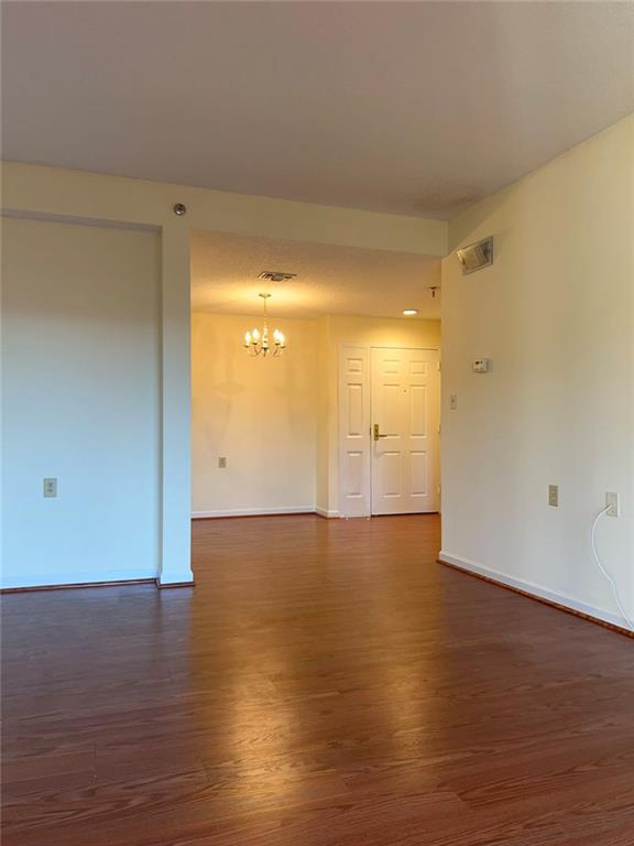 1800 Clairmont Lake, Unit 711 Decatur, GA 30033 - Photo 10 of 40 a view of an empty room and wooden floor