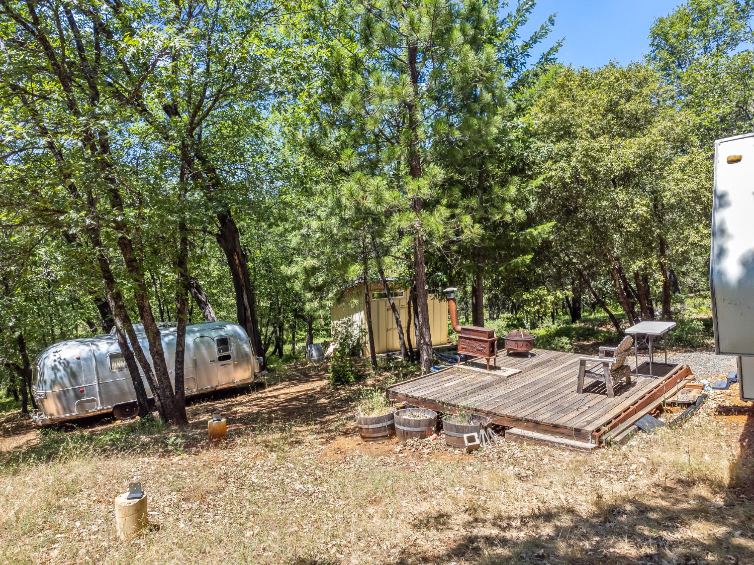 2640 Trail Gulch Road Placerville, CA 95667 - Photo 20 of 37 a backyard of a house with barbeque oven and outdoor seating
