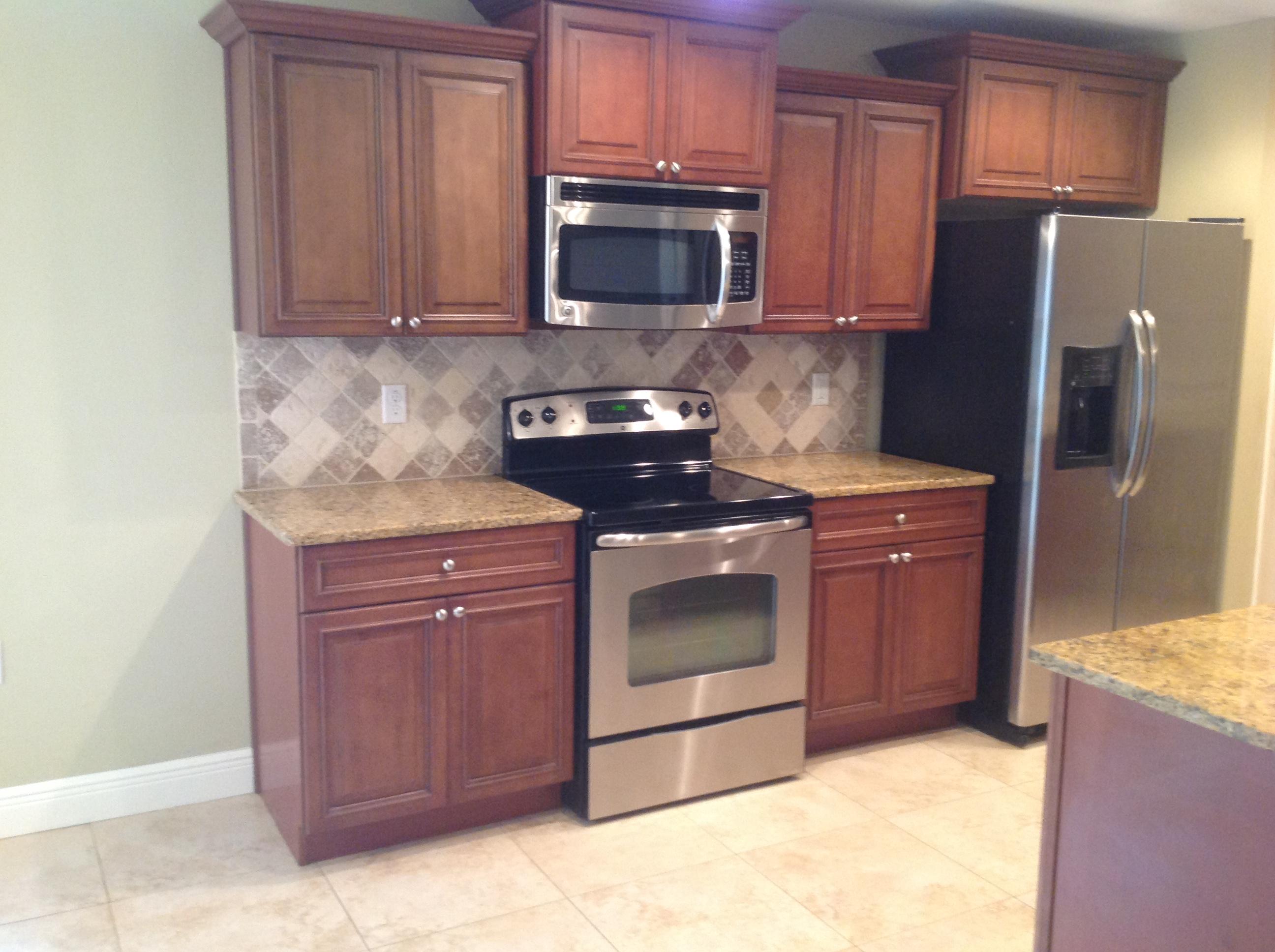 227 January Court Crestview, FL 32539 - Photo 10 of 20 a kitchen with stainless steel appliances granite countertop a stove a microwave a refrigerator and cabinets