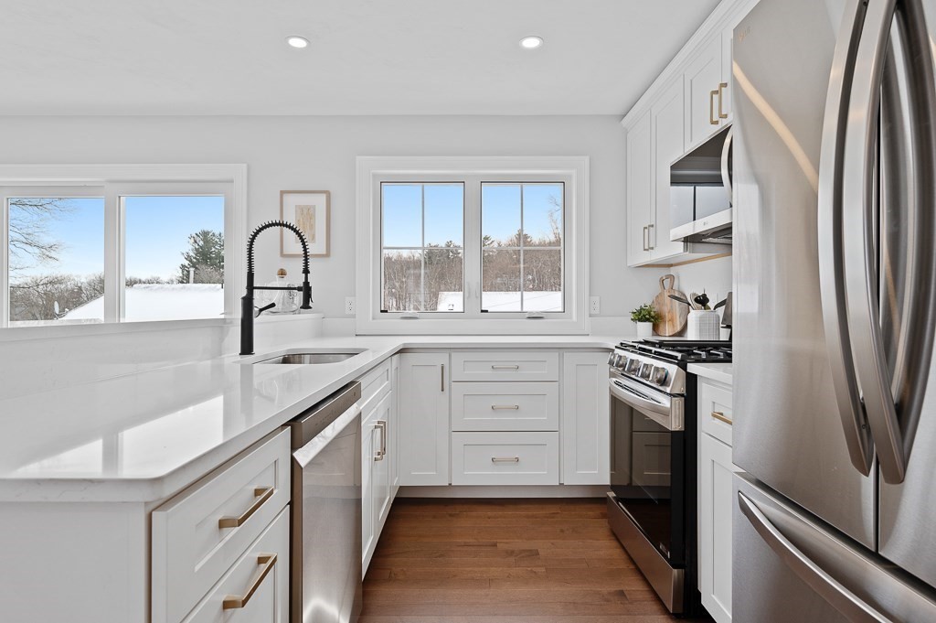 29 3rd Worcester, MA 01602 - Photo 8 of 38 a kitchen with stainless steel appliances granite countertop a sink stove and refrigerator