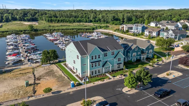 an aerial view of residential houses with outdoor space