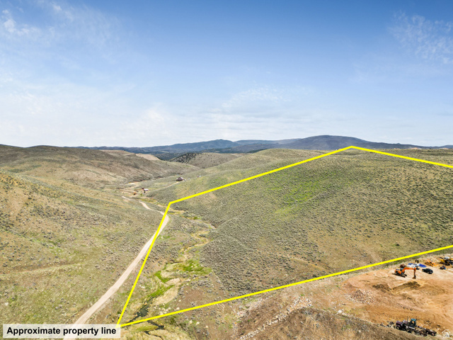 55 Browns Canyon Road, Unit 55 Peoa, UT 84061 - Photo 10 of 17 Aerial view of property's location with property boundaries highlighted and a mountain backdrop