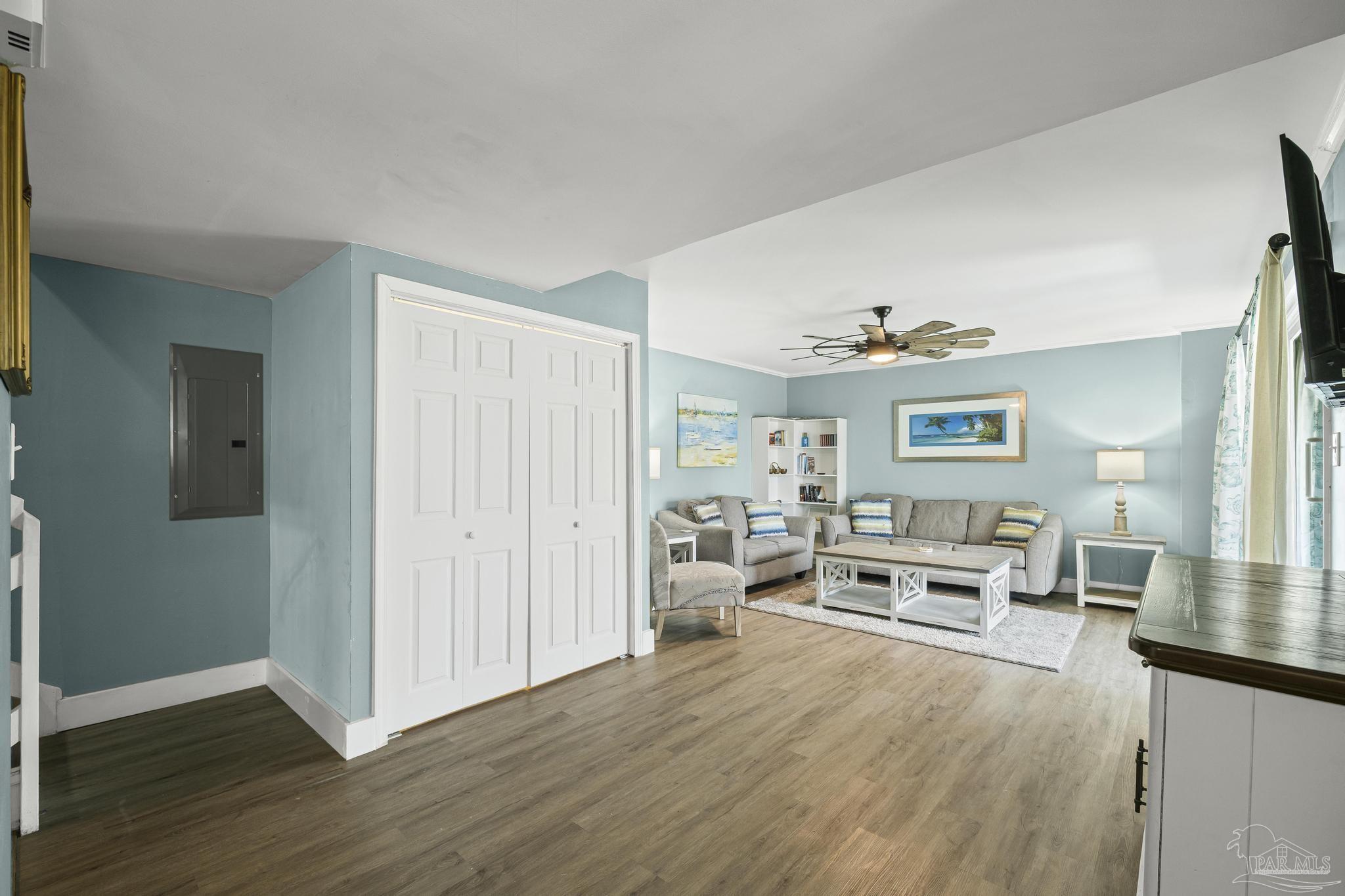 1100 Fort Pickens Road, Unit A13 Pensacola Beach, FL 32561 - Photo 12 of 63 a living room with furniture and a wooden floor