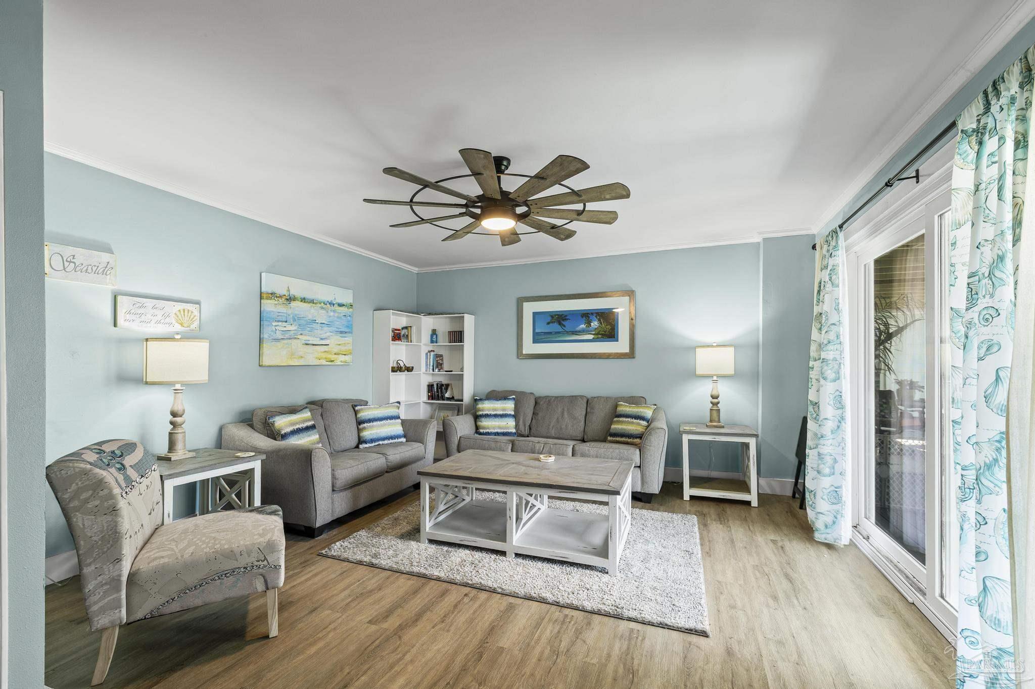 1100 Fort Pickens Road, Unit A13 Pensacola Beach, FL 32561 - Photo 13 of 63 a living room with furniture and a wooden floor