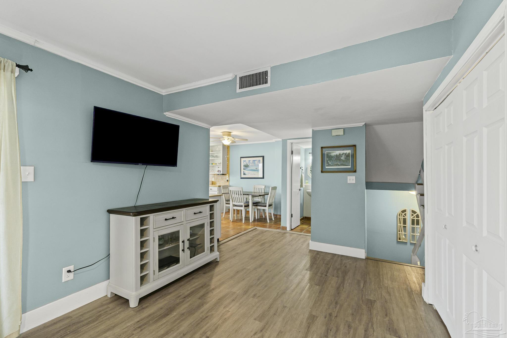 1100 Fort Pickens Road, Unit A13 Pensacola Beach, FL 32561 - Photo 16 of 63 a view of a livingroom with furniture and wooden floor