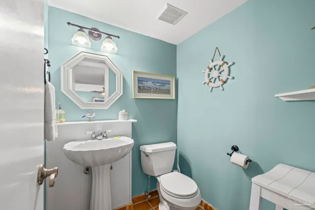 a view of a livingroom with furniture and a chandelier fan