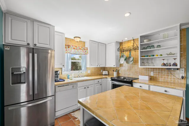 a kitchen with a sink and cabinets