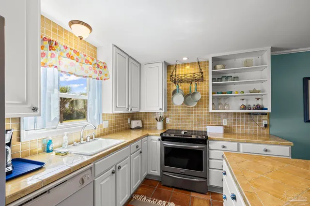 a view of kitchen with furniture and wooden floor