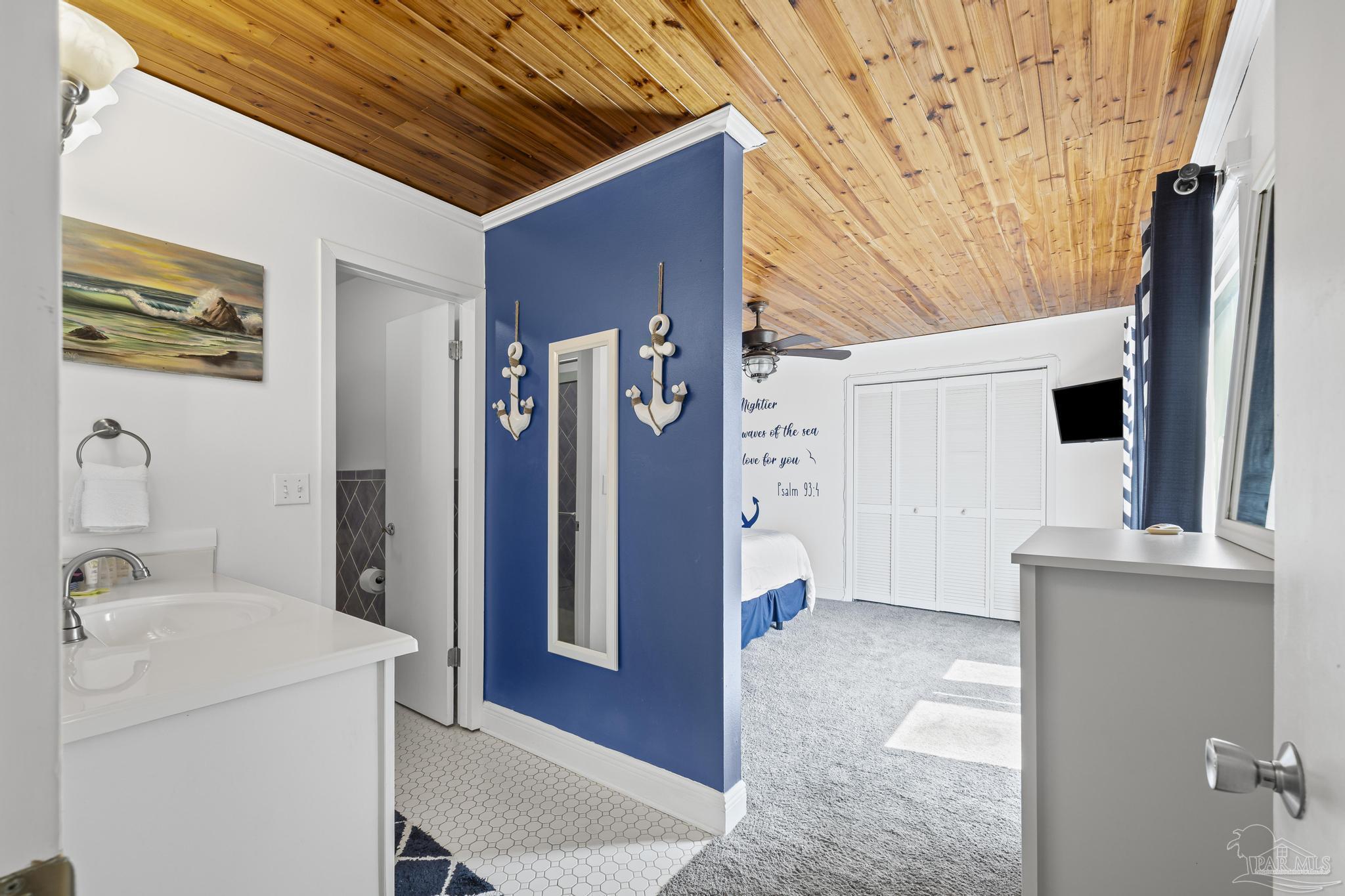 1100 Fort Pickens Road, Unit A13 Pensacola Beach, FL 32561 - Photo 34 of 63 a view of bathroom with a sink and mirror