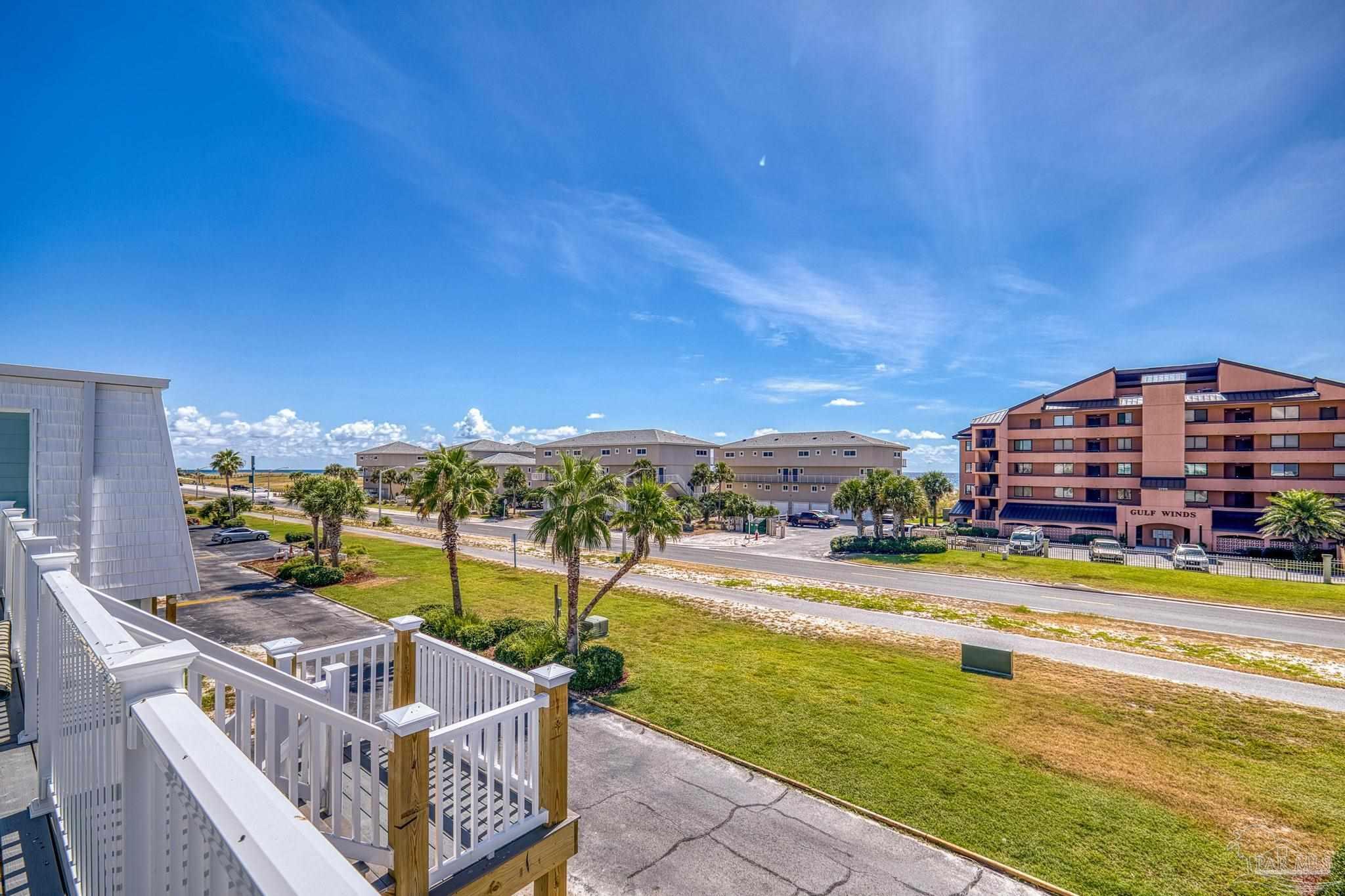 1100 Fort Pickens Road, Unit A13 Pensacola Beach, FL 32561 - Photo 38 of 63 a view of a swimming pool with a lounge chairs