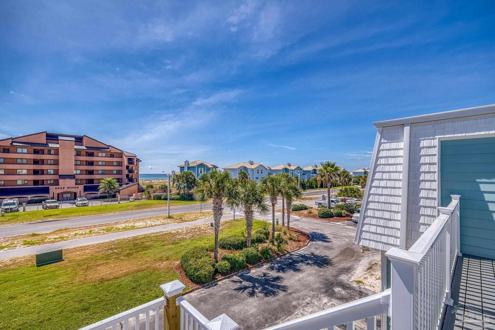 1100 Fort Pickens Road, Unit A13 Pensacola Beach, FL 32561 - Photo 41 of 63 a view of a city with lawn chairs