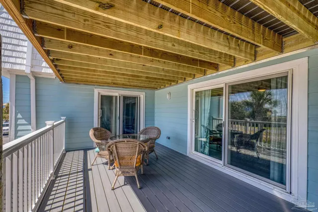 a view of a patio with wooden floor