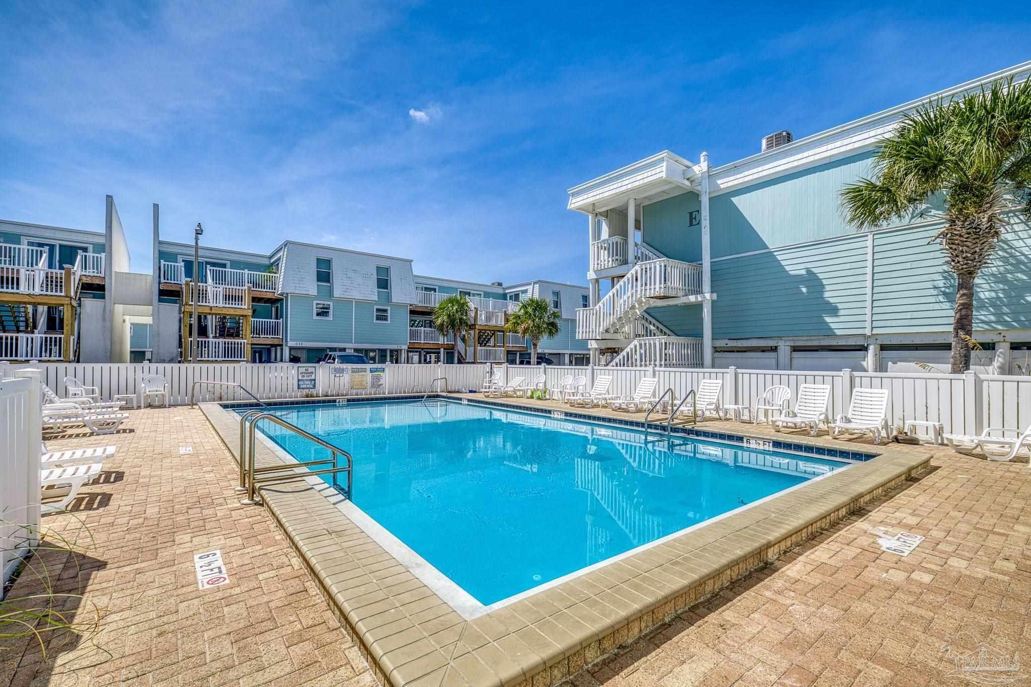 1100 Fort Pickens Road, Unit A13 Pensacola Beach, FL 32561 - Photo 48 of 63 a view of a patio with swimming pool